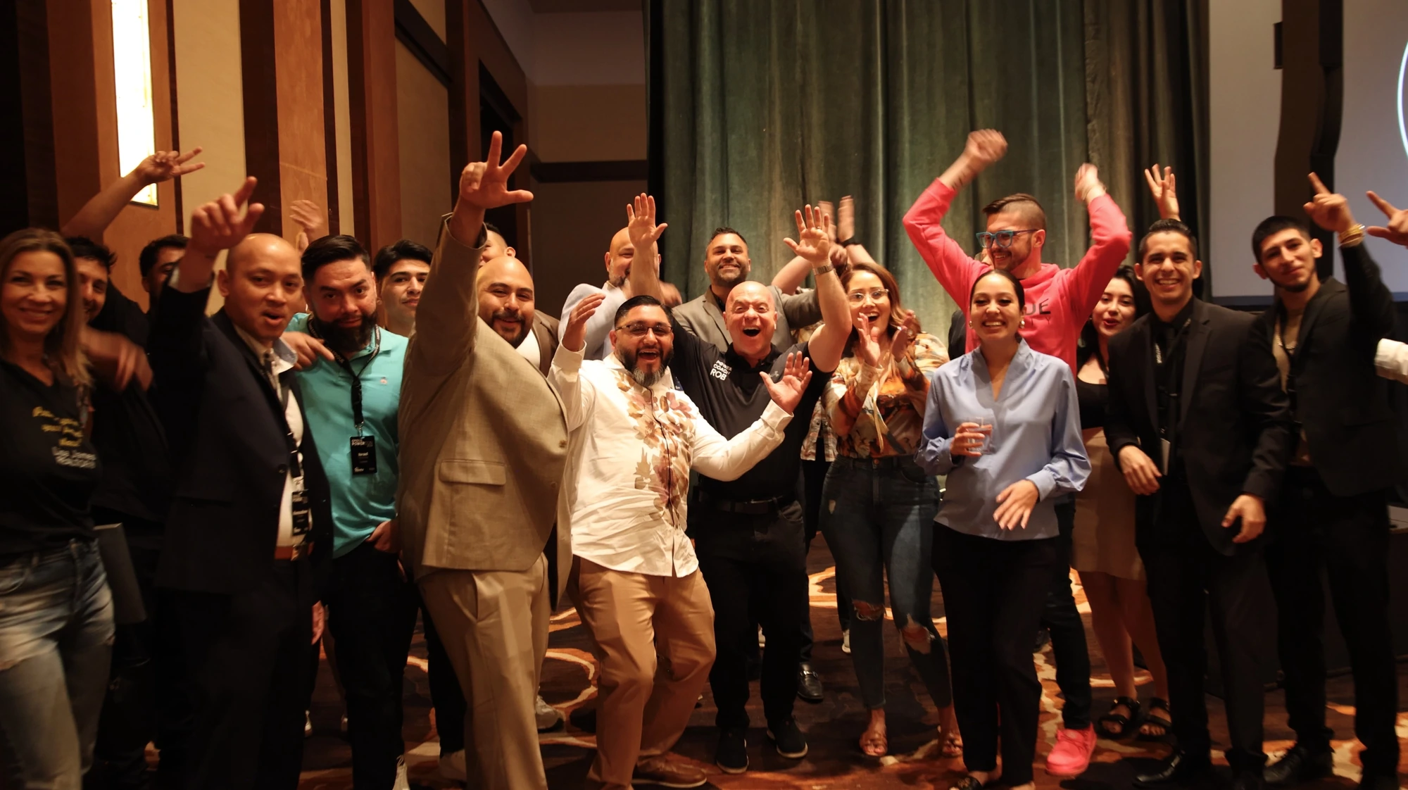 An enthusiastic group participating together at a Rob Stein leadership conference